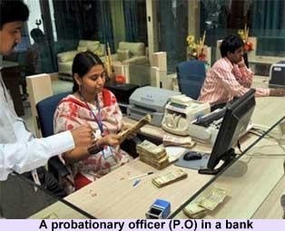 A Bank PO probationary officer working in their office